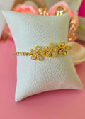 Pulsera de tres margaritas con mecate brillante