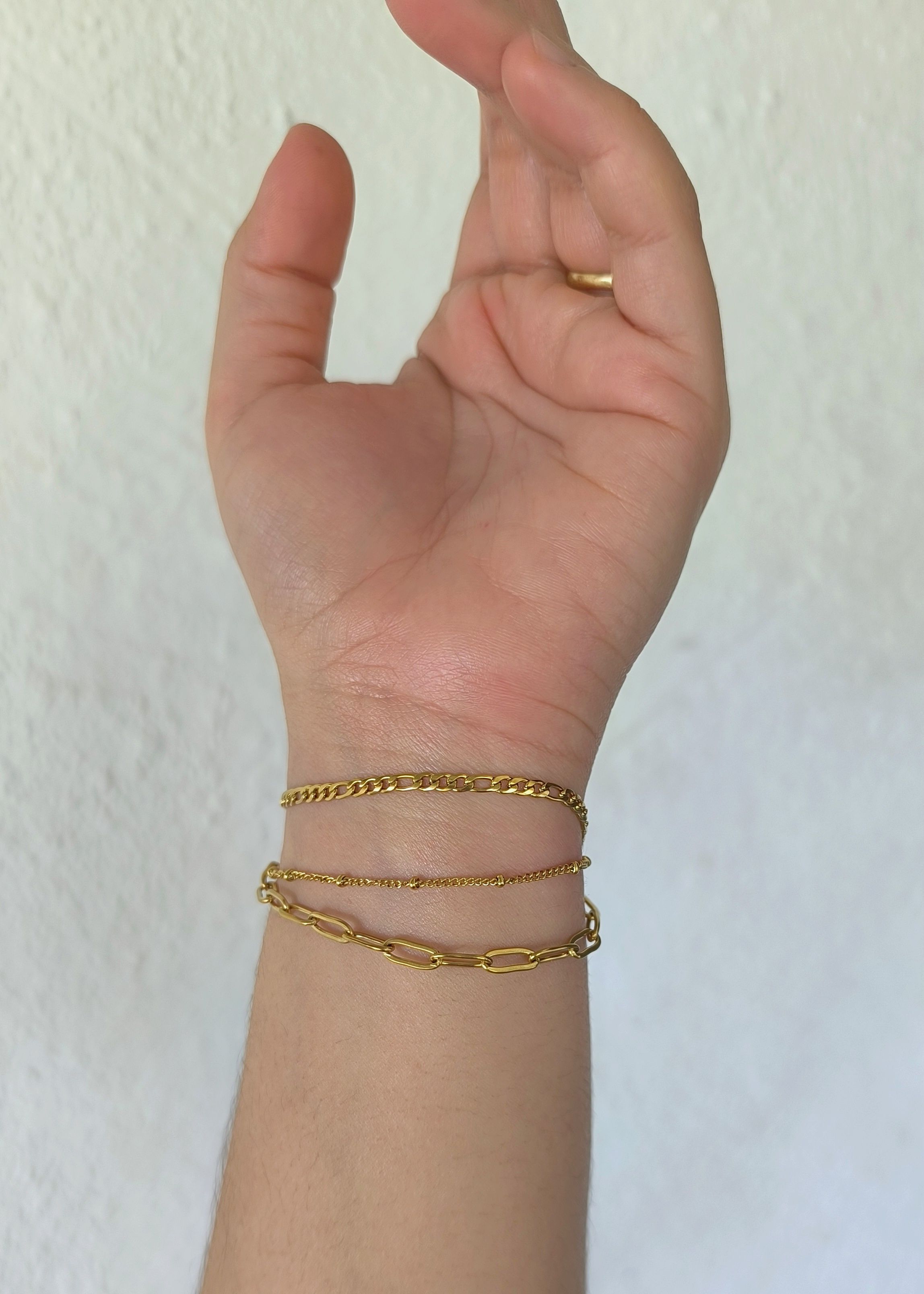 Pulsera triple de acero con tres tramas