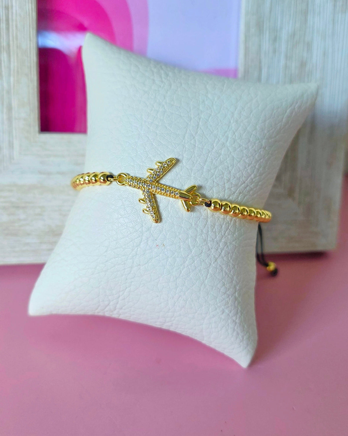 Pulsera avión brillante y agarre de bolitas