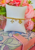 Pulsera ajustable de avion, corazon y taza hecha con hilo