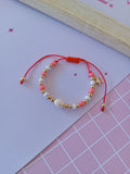 Pulsera mostacillas rosa y blanca con perla y estrellita