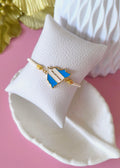 Pulsera ajustable de mecate blanco y mapa esmaltado