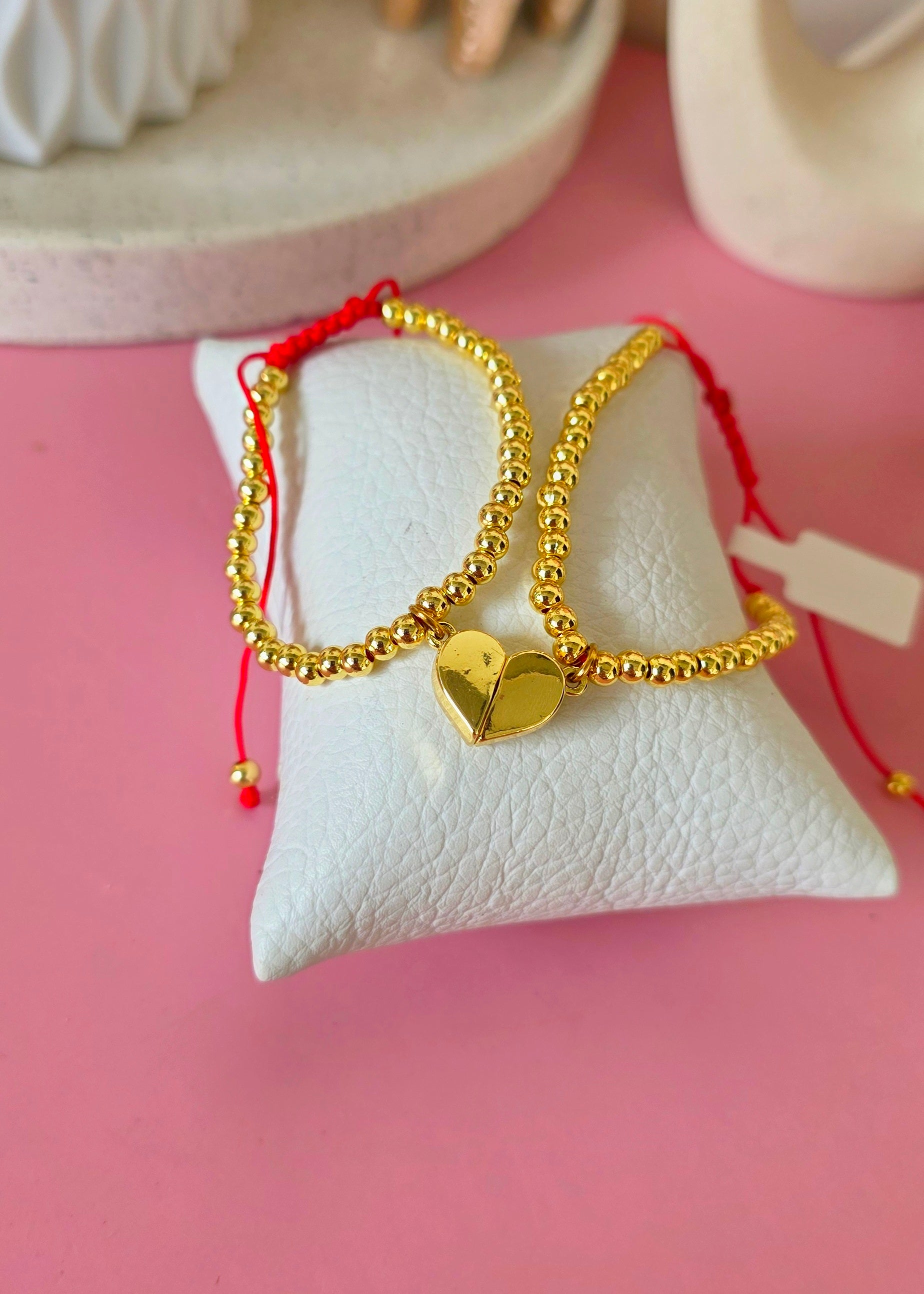 Set de pulseras ajustables  cln dije corazon imantado